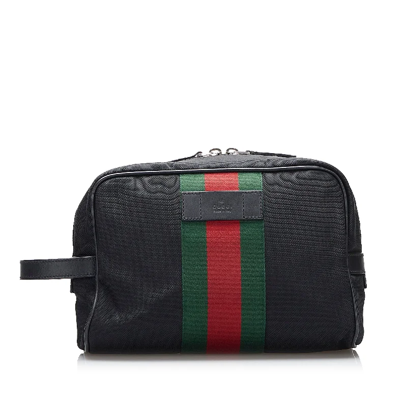 Women Gucci bags with interlocking G hardware for a classic lookBlack Gucci Techno Web Canvas Clutch