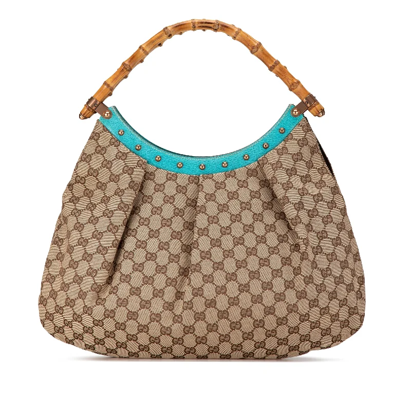 Women Gucci Sylvie bags with a monogram - embossed leatherBrown Gucci GG Canvas Bamboo Studded Hobo