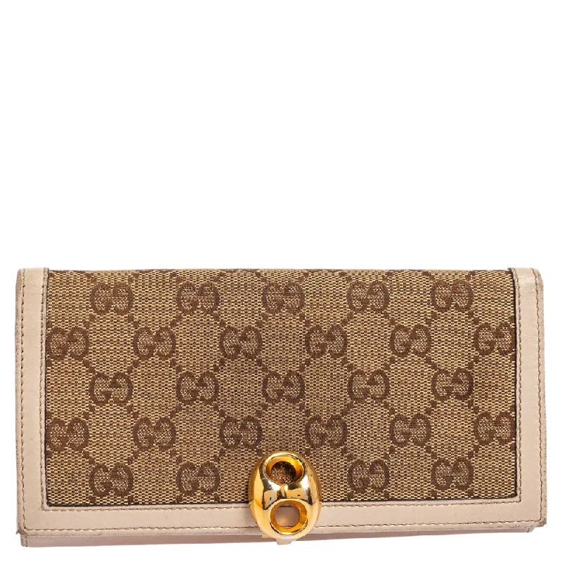 Women Gucci Sylvie bags featuring the signature web stripeGucci Beige/Ivory GG Canvas and Leather Continental Wallet