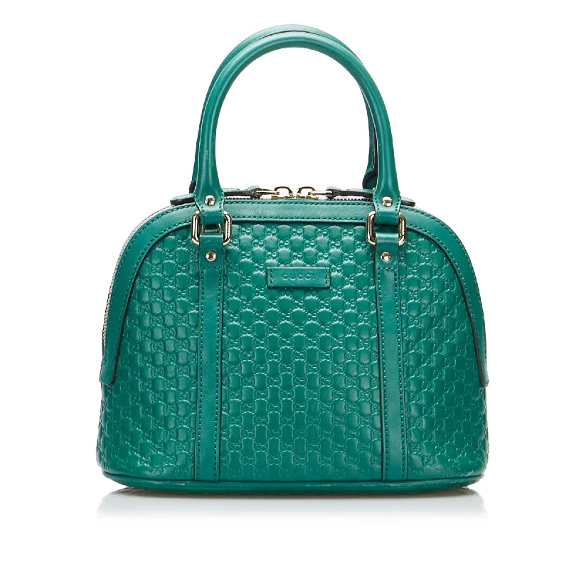 Women Gucci Sylvie bags with a monogram - embossed leatherGucci Dome Handbag Mini Teal Blue Microguccissima