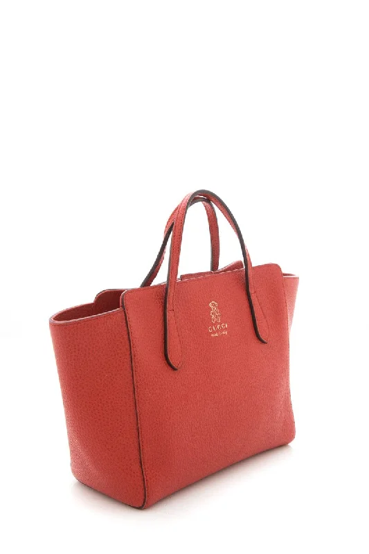 Women Gucci crossbody bags in a bold red colorGucci Burnt Orange Swing Tote Small Handbag