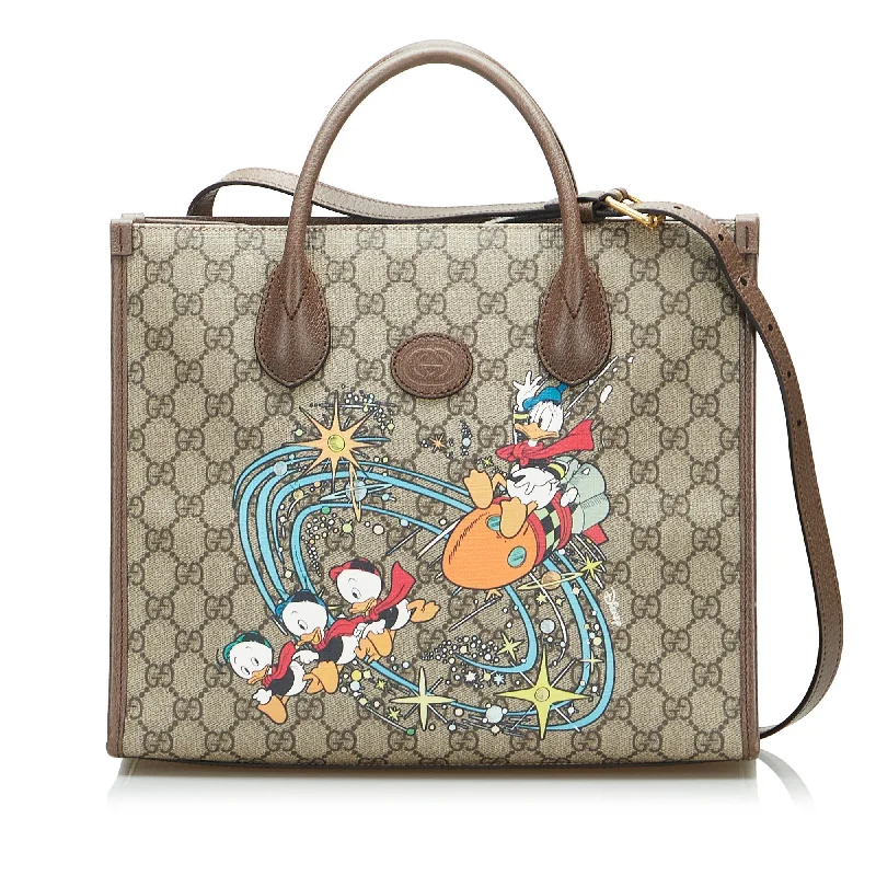 Women Gucci backpacks with a luxurious leather finishGucci x Disney Tote Bag Small Donald Duck GG Supreme Canvas