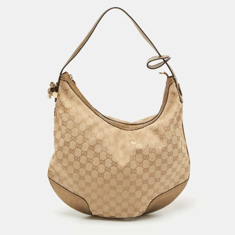 Women Gucci bags with a snap - button closure and a decorative charmGucci Beige/Gold GG Canvas and Leather Large Princy Hobo