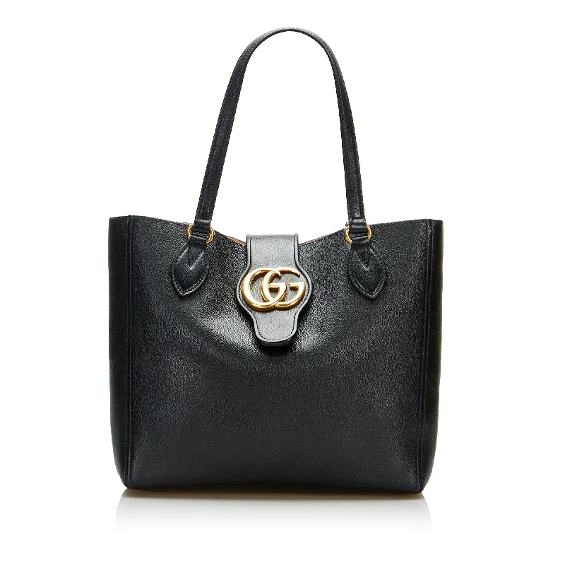 Women Gucci Sylvie bags featuring the signature web stripeGucci Dahlia Double G Tote Small Black