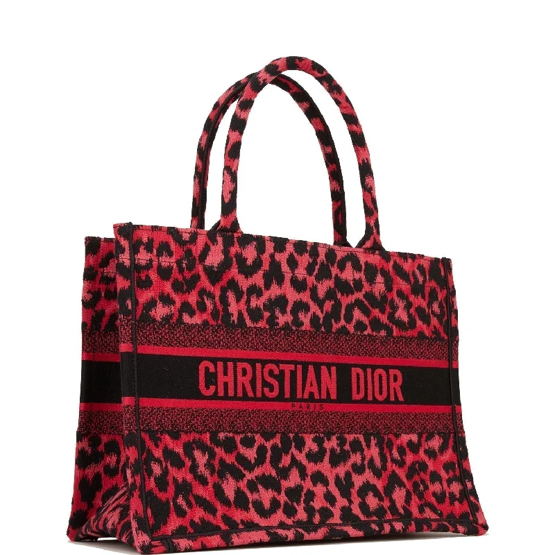 Christian Dior Saddle bags with a patent leather finish for a shiny lookChristian Dior Book Tote Fuchsia Leopard Canvas